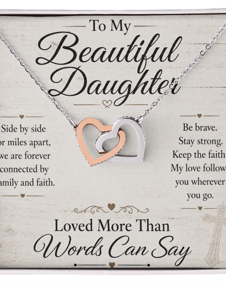 Necklace with interlocking hearts on a card for a daughter, featuring motivational text.