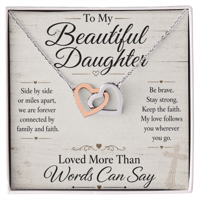 Necklace with interlocking hearts on a card for a daughter, featuring motivational text.