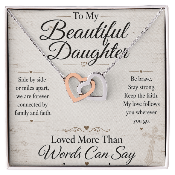 Necklace with interlocking hearts on a card for a daughter, featuring motivational text.