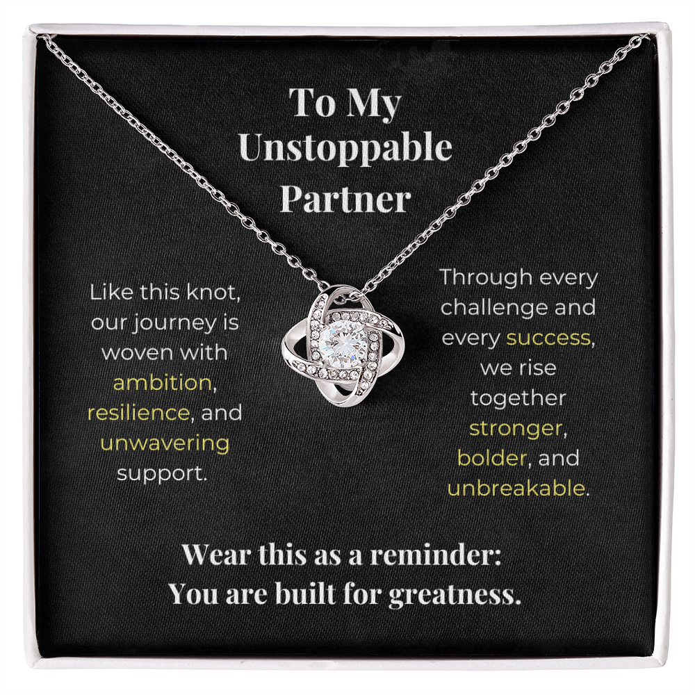 Silver love knot necklace with crystal pendant in gift box, featuring inspirational message for unstoppable partners about ambition, resilience and shared success.