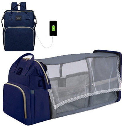 Blue diaper backpack with fold-out changing station and mosquito net